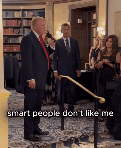 Donald Trump Speaking Into A Microphone With The Words Smart People Don 'T Like Me Behind Him GIF
