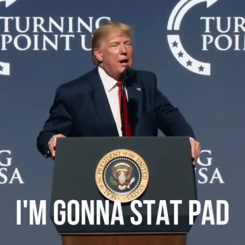 Donald Trump Stands At A Podium With The Words I 'M Gonna Stat Pad Written Below Him GIF