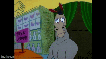 Donkey Standing Before Free Sample Sign