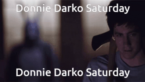 Donnie Darko Saturday And Donnie Darko Saturday Are Written On A Dark Background GIF