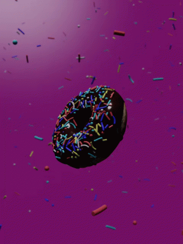 Donut with Chocolate Frosting and Sprinkles on Pink Background