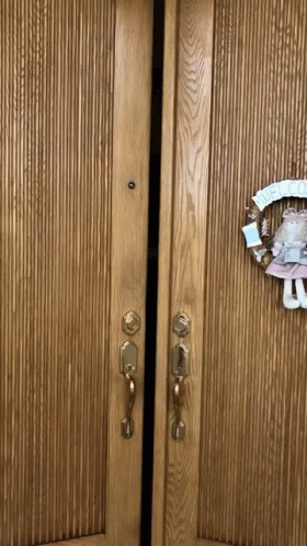 Door With Wreath Saying Welcome GIF