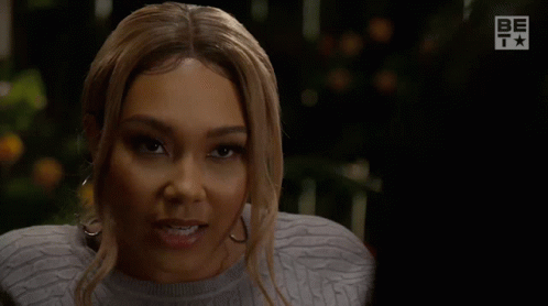 Doubtful Saucy Lady Squinting GIF