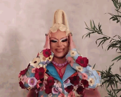 Drag Queen Covering Face With Hands