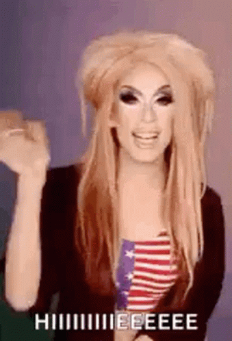 Drag Queen in American Flag Shirt with Hands Up and Funny Face