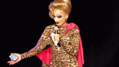 Drag Queen in Leopard Print Dress Holding Microphone