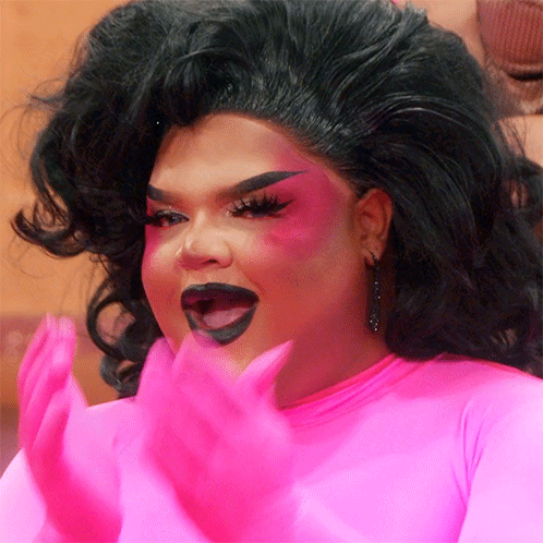 Drag Queen In Pink Top And Pink Gloves GIF