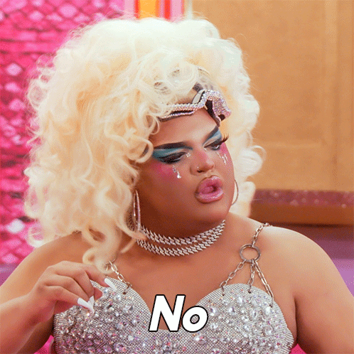 Drag Queen Wearing Wig and Necklace Says No