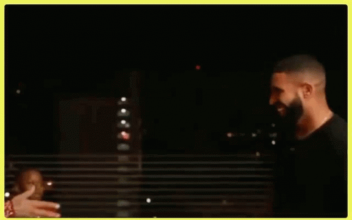 Drake And Chris Brown Are Shaking Hands In A Dark Room . GIF