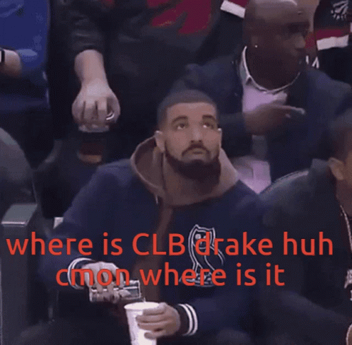 Drake Is Sitting In The Stands At A Basketball Game And Holding A Cup GIF