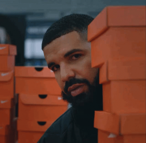 Drake Lurking Behind The Boxes Of Shoes GIF