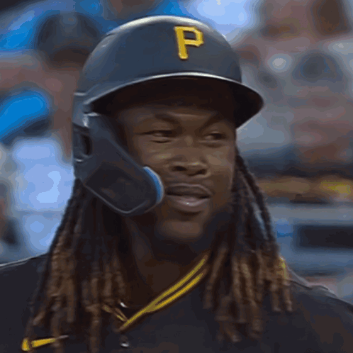 Dreadlocked Baseball Player in Helmet and Black Shirt