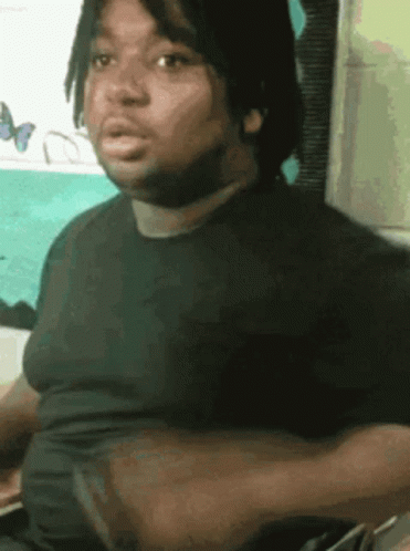 Dreadlocked Man in Black Shirt Making Funny Face