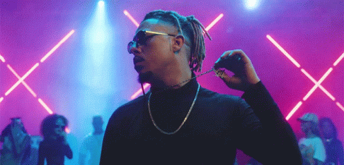 Dreadlocked Man in Sunglasses and Gold Chain