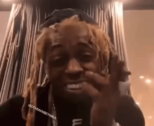 Dreadlocked Man Making Funny Face Wearing Hat