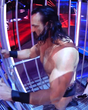 Drew Mcintyre And Dominik Mysterio Locked In Cage GIF