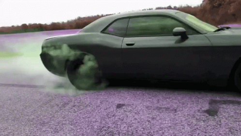 Drifting Car on Gravel Road With Smoking Tire