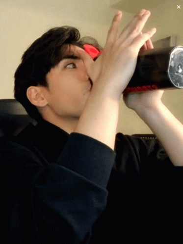 Guy Drinking Water With Two Hands GIF
