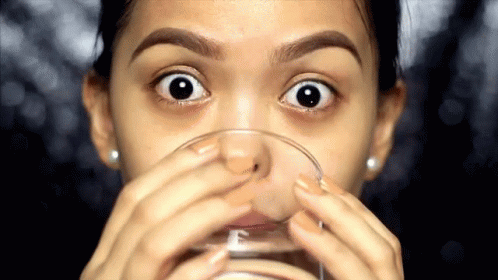 Girl Sips Drinking Water On Glass GIF