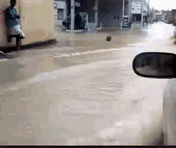 Driving Car Flash Flood Gas Station GIF