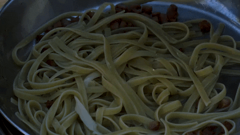 Drizzling Yellow Sauce On Noodles GIF