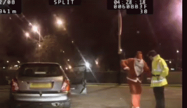 Drunk Santa Questioned By Police GIF