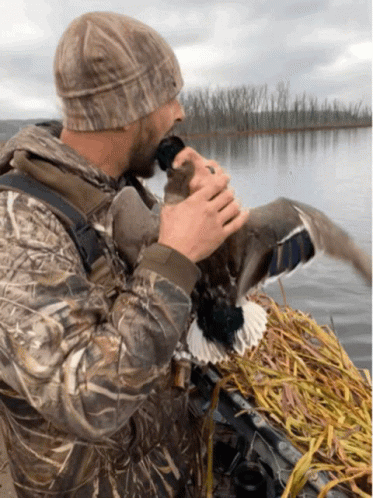 Duck Hunting Man Kisses Captured Duck GIF