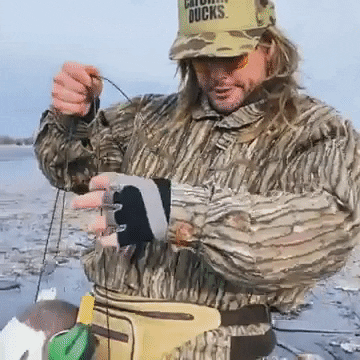 Duck Hunting Man With Plastic Duck Baits GIF