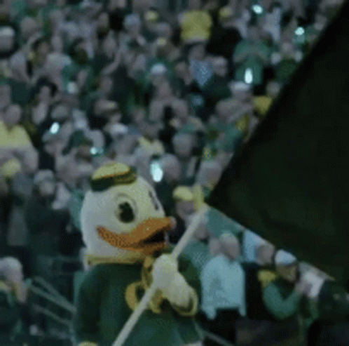 Duck Mascot Holding Flag GIF