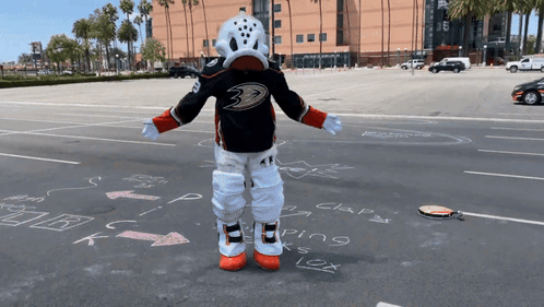 Duck Mascot Standing In Parking Lot GIF