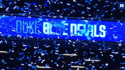 Duke Blue Devils Confetti Falling In Front Of A Large Screen GIF