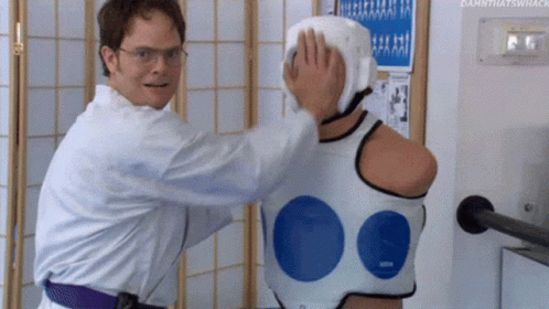Dwight Schrute Punching A Doll GIF