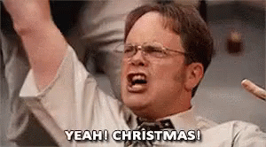Dwight Schrute From The Office Is Screaming With His Arms In The Air And Saying `` Yeah ! Christmas ! '' GIF
