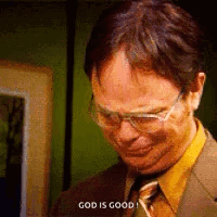 Dwight Schrute Is Wearing Glasses And A Suit And Tie . GIF