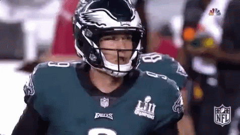 Eagles Football Player With Helmet on Field