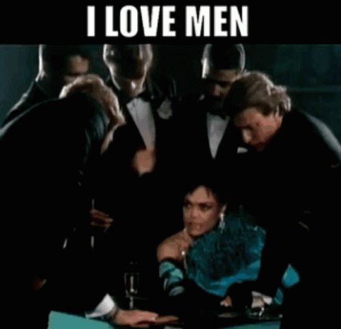Eartha Kitt Surrounded By Many Men GIF
