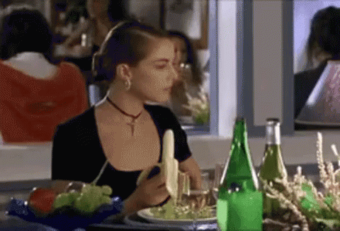 Classy Woman Eating Banana GIF