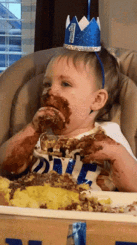 Kid Eating Cake All Over The Face GIF