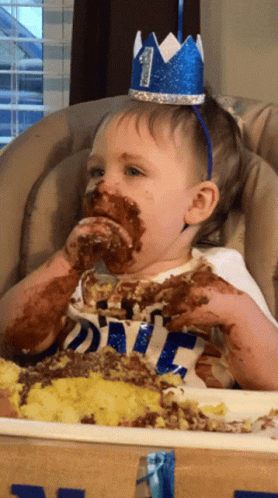 Kid Eating Cake With Hands GIF