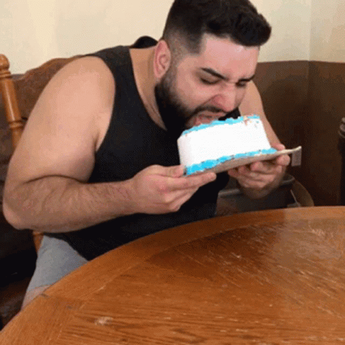 Guy Eating And Licking Cake GIF