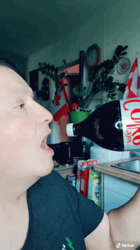 Eating Coca Cola Bottle GIF