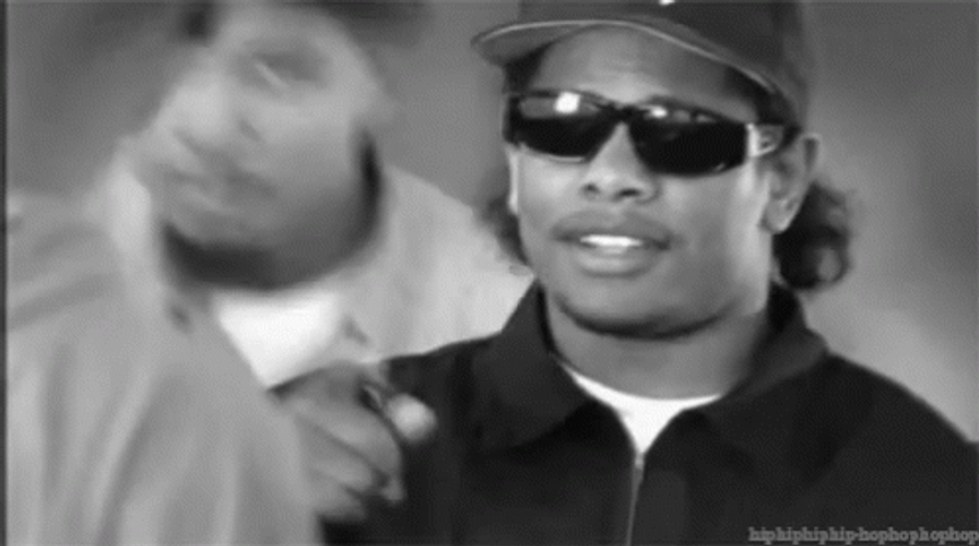 Eazy E Wearing Dark Shades Pointing GIF