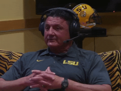 Ed Orgeron Laughing While Wearing Headset GIF
