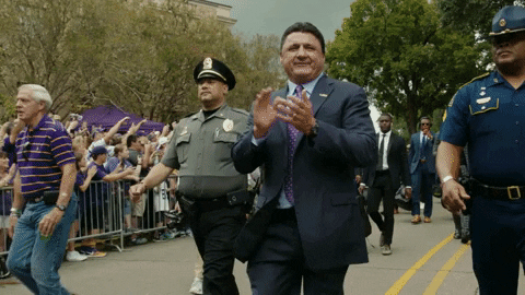 Ed Orgeron Walking With Cops On Side GIF