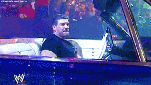 Eddie Guerrero Driving Blue Car Inside Arena GIF