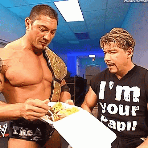 Eddie Guerrero Feeding Dave Batista GIF