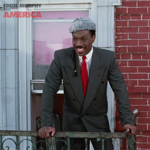 Cheerful Eddie Murphy On The Balcony GIF