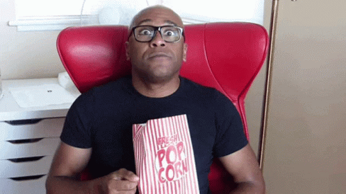 Edge Of My Seat Eating Popcorn GIF