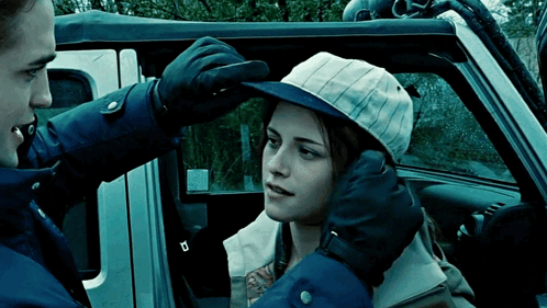 Edward Cullen Putting Cap Bella Swan GIF