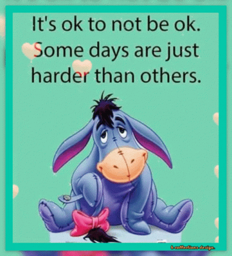 Eeyore From Winnie The Pooh Is Sitting Down With A Pink Bow On His Tail GIF